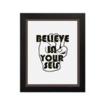 Inspirational quote wall art featuring Believe In Yourself on a white background and black framed on the wall. Perfect for motivating your home office.