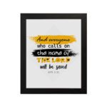 Infidu Bible Wall Art featuring Acts 2:21 with layered text in yellow, black, and white on a textured yellow and black background. hung on the wall in a black frame