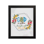 God Is Within Her She Will Not Fall Psalm 46:5 Bible Verse Wall Art with colorful flowers and modern design hung on the wall in a black frame