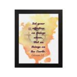 Set Your Affection on Things Above Colossians 3:2 Bible Verse Wall Art with subtle cross and watercolor background hung on the wall in a black frame