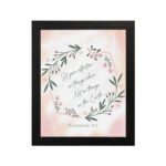 Infidu Set Your Affection On Things Above Bible Wall Art with floral wreath and pink background. hung on the wall in a black frame