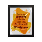 Bible wall art featuring Psalm 63:3 with bold and cursive text on a gray background with orange patterns. hung on the wall in a black frame