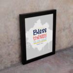 Bless The Lord O My Soul Psalm 103:1 Christian wall art in bold blue and orange, with a light gray background and splash design. displayed on the wall in a black frame