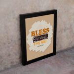 Infidu Bless The Lord O My Soul Psalm 103:1 Christian wall art featuring orange and black text on a beige background. displayed on the wall in a black frame