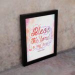 Bless The Lord O My Soul Psalm 103:1 Christian Wall Art with pastel colors and gradient script. displayed on the wall in a black frame