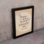 Christian wall art with the phrase "Your Right Hand Upholds Me" Psalm 63:8, featuring bold text and floral accents on a peach background. displayed on the wall in a black frame