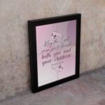 Christian wall art with the verse May The Lord Cause You To Flourish Both You And Your Children Psalm 115:14 in soft colors and floral design. displayed on the wall in a black frame