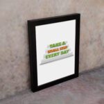 Infidu Take A Small Step Every Day wall art with a motivational quote and black frame on the wall. Perfect decor for home offices and workspaces.