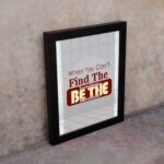 Infidu When You Can't Find The Sunshine Be The Sunshine wall art with a gray and white background and red text and black frame on the wall Inspiring decor for any workspace.