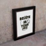 Inspirational quote wall art featuring Believe In Yourself on a white background on the wall. Perfect for motivating your home office.