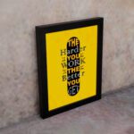 Infidu The Harder You Work The Better You Get wall art with a yellow background and dark yellow and white text with black shadow and black frame on the wall. Inspiring decor for home offices and workspaces.