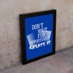 Infidu motivational quotes wall art featuring Don’t Wait For Opportunity, Create It on a blue background and black frame on the wall. inspire your workspace