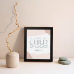 Bless The Lord O My Soul Psalm 103:1 Christian wall art with soft gray and peach tones, elegant font, and abstract brushstroke background. displayed on the wall in a black frame