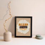 Infidu Bless The Lord O My Soul Psalm 103:1 Christian wall art featuring orange and black text on a beige background. displayed on the wall in a black frame