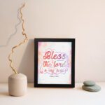 Bless The Lord O My Soul Psalm 103:1 Christian Wall Art with pastel colors and gradient script. displayed on the wall in a black frame