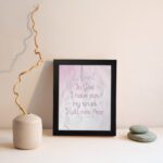 Christian wall art featuring Psalm 56:4, with soft pink background and elegant script font. Perfect for home decor. displayed on the wall in a black frame