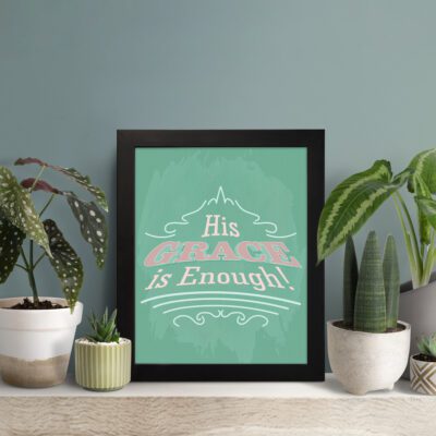 His Grace Is Enough Christian Wall Art with vintage typography on a mint green background displayed on the table in a black frame