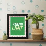 Infidu motivational quotes wall art featuring You Are Your Only Limit on a green corner with a red flower background black framed on the table. inspire your workspace