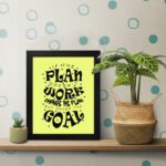 Infidu If The Plan Doesn't Work Change The Plan But Never The Goal wall art with a light green background and dark blue star design and black frame on the table. Inspiring decor for home offices and workspaces.