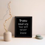 Infidu motivational quotes wall art featuring If You Never Try You Will Never Know on a dark black background and black frame displayed on the wall. Perfect for inspiring your workspace.