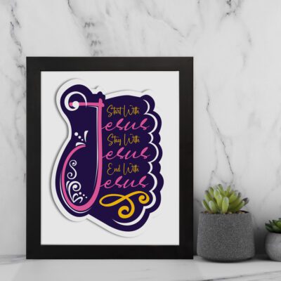 Bible wall art featuring Start With Jesus, Stay With Jesus and End With Jesus in bold and cursive fonts with bright colors on a white background. displayed on the wall in a black frame