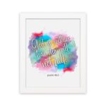 Infidu wall art featuring vibrant watercolor background and the text God Is Within Her She Will Not Fall Psalm 46:5. hung on the wall in a white frame