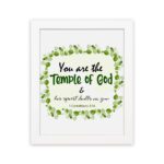 You Are The Temple Of God, His Spirit Dwells In You 1 Corinthians 3:16 Bible Verse Wall Art with green leaf wreath design. hung on the wall in a white frame