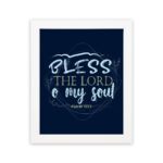 Infidu wall art featuring Bless The Lord O My Soul Psalm 103:1 in gold and white text on a dark blue background with decorative leaves. hung on the wall in a white frame