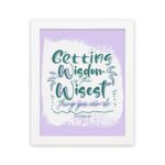 Christian wall art with Getting Wisdom Is The Wisest Thing You Can Do Proverbs 4:7, green text, light purple background, and decorative swirls. hung on the wall in a white frame