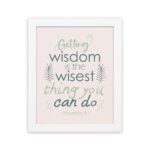 Infidu wall art with Proverbs 4:7 text surrounded by green leaves on a beige background. Elegant and minimal design. hung on the wall in a white frame