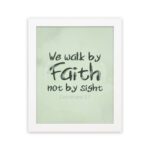 We Walk By Faith Not By Sight Bible Verse Wall Art on a mint green background. hung on the wall in a white frame