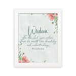 Christian wall art with Proverbs 2:6, featuring "Wisdom" and floral accents on a cream background. hung on the wall in a white frame