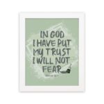 In God I Have Put My Trust, I Will Not Fear Psalm 56:4 bold Christian wall art with green background and brushstroke lettering hung on the wall in a white frame