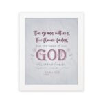 Christian wall art with the verse The Grass Withers, The Flower Fades But The Word Of Our God Will Stand Forever Isaiah 40:8. hung on the wall in a white frame