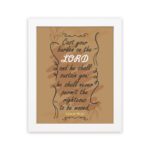 Christian wall art featuring Psalm 55:22, with a warm brown background, dark text, and elegant scrollwork. Perfect for home decor. hung on the wall in a white frame