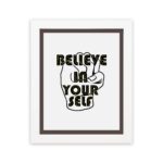 Inspirational quote wall art featuring Believe In Yourself on a white background and white framed displayed on the wall. Perfect for motivating your home office.