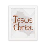 Jesus Christ Bible wall art with hand-drawn brown lettering and a minimalist white-gray watercolor background in a black frame. hung on the wall in a white frame