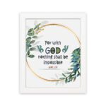 Wall art featuring the quote With God Nothing Shall Be Impossible from Luke 1:37, surrounded by a golden frame and green leaves. hung on the wall in a white frame