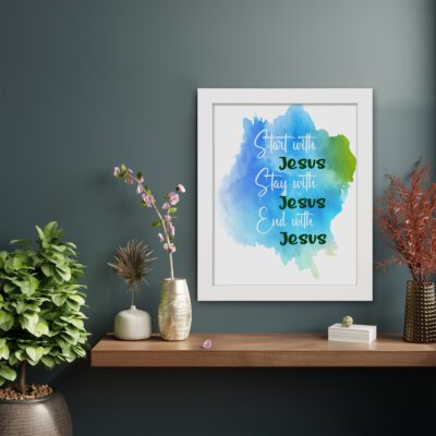 Bible wall art featuring the phrases Start With Jesus, Stay With Jesus, and End With Jesus in cursive on a watercolor blue and green background. displayed on the wall in a displayed frame