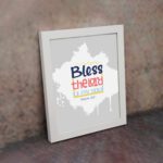 Bless The Lord O My Soul Psalm 103:1 Christian wall art in bold blue and orange, with a light gray background and splash design. displayed on the wall in a white frame