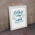 Proverbs 4:7 Christian wall art with elegant script and floral design, featuring Getting Wisdom Is The Wisest Thing You Can Do. displayed on the wall in a white frame