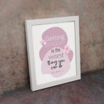 Christian wall art featuring the quote Getting Wisdom Is The Wisest Thing You Can Do from Proverbs 4:7, with pink flowers and soft colors. displayed on the wall in a white frame