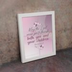 Christian wall art with the verse May The Lord Cause You To Flourish Both You And Your Children Psalm 115:14 in soft colors and floral design. displayed on the wall in a white frame