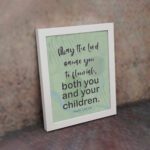 Christian wall art with Psalm 115:14 Bible verse on a light green and gray background with black font and white frame on the wall