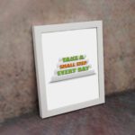 Infidu Take A Small Step Every Day wall art with a motivational quote and white frame on the wall. Perfect decor for home offices and workspaces.