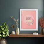 And Everyone Who Calls On The Name Of The Lord Will Be Saved Acts 2:21 Bible Verse Wall Art with pink flowers and soft pink background. displayed on the wall in a white frame