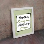 Infidu motivational quotes wall art featuring Together Everyone Achieves More on a light gray and light green background and white frame on the wall. the inspiring teamwork