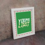 Infidu motivational quotes wall art featuring You Are Your Only Limit on a green corner with a red flower background white framed on the wall. inspire your workspace