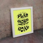 Infidu If The Plan Doesn't Work Change The Plan But Never The Goal wall art with a light green background and dark blue star design and white frame on the wall. Inspiring decor for home offices and workspaces.