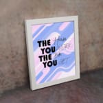 Infidu motivational quotes wall decor featuring The Harder You Work The Better You Get on a mixed white, pink, and navy blue background on the table. Perfect for inspiring your workspace.